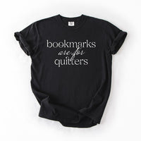 Flat lay of black “Bookmarks Are for Quitters” tee – funny bookish graphic tee for readers
