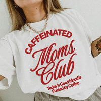 Model wearing Caffeinated Moms Club tee in white — funny coffee shirt for moms