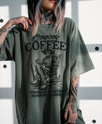 Model wearing Cowboy Coffee graphic tee in moss — western t-shirt for coffee-loving women