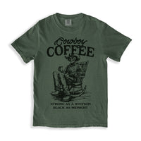 Flat lay of Cowboy Coffee tee in moss — vintage-inspired country shirt with black print