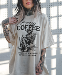 Model wearing Cowboy Coffee tee in ivory — relaxed fit cowgirl graphic tee with coffee theme