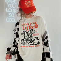 Model wearing Drink Some Coffee tee with trucker hat and cardigan — western coffee graphic tee for women