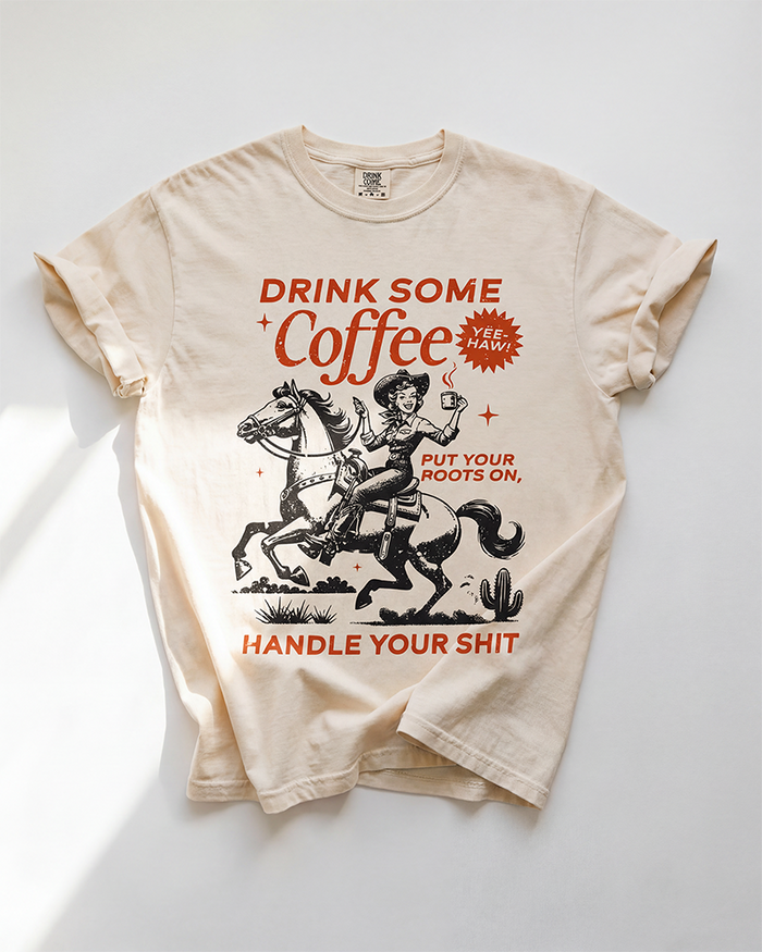 Ivory Drink Some Coffee Western heavyweight tee with vintage cowgirl, horse and coffee graphic in rust and black.