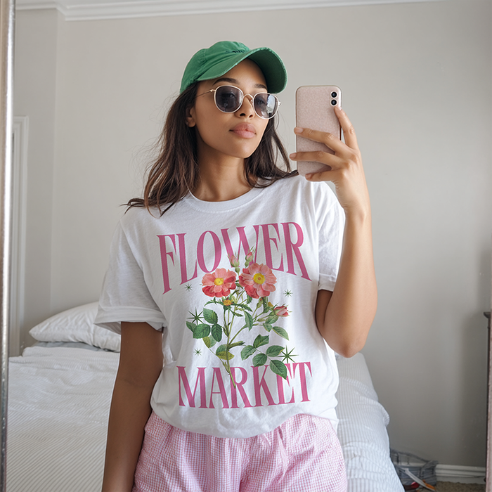 Model wearing white Flower Market tee — vintage floral spring graphic shirt for women