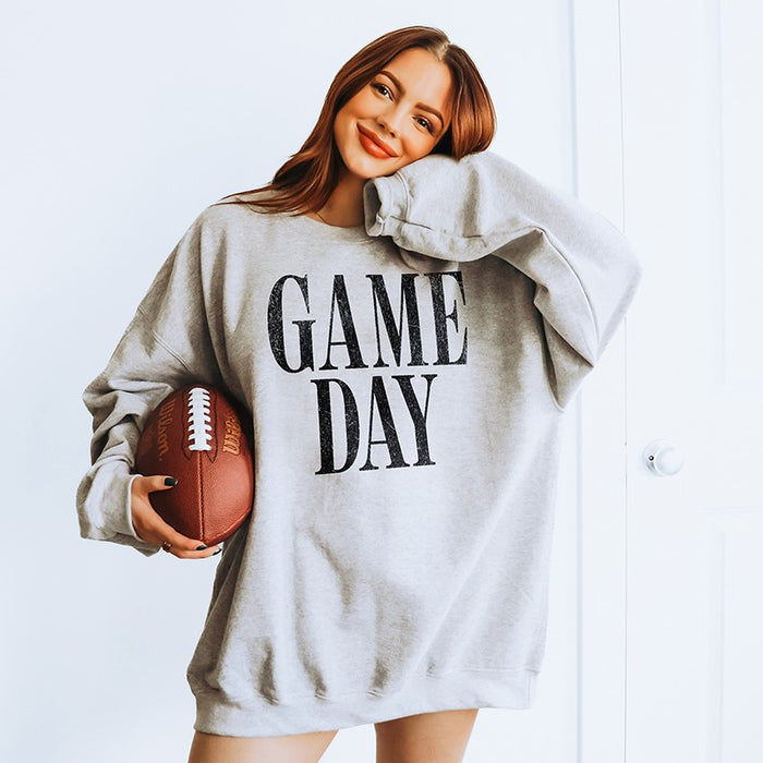 Woman wearing oversized Game Day sweatshirt in sport grey — cozy unisex fleece crewneck for football season and fall weekends.