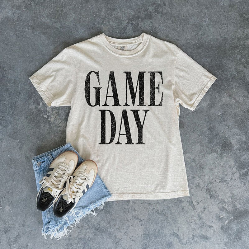 Ivory Game Day Comfort Colors tee styled with denim cutoff shorts and sneakers — sporty boutique outfit for football, baseball, basketball, or soccer fans.