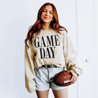 Woman wearing Sand Game Day sweatshirt — cozy unisex fleece crewneck for football season and fall weekends.