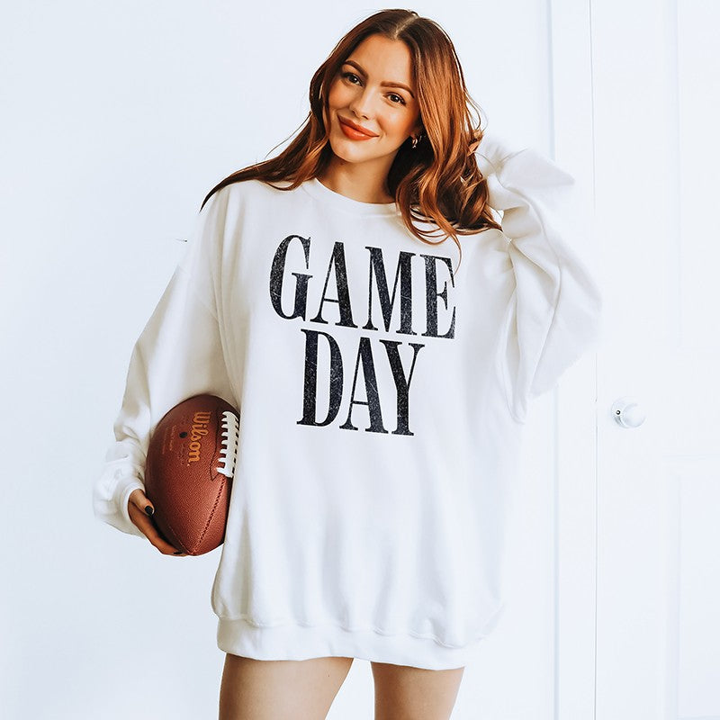Woman wearing oversized Game Day sweatshirt in white — cozy unisex fleece crewneck for football season and fall weekends.