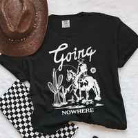 Flat lay of black Going Nowhere western tee — relaxed fit country shirt with white print