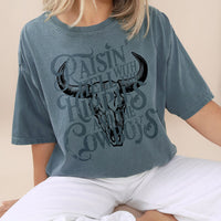 Model in ice blue graphic tee — trendy western tee for free-spirited women