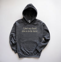 Dark heather “I Put My Book Down To Be Here” hoodie – soft fleece bookish sweatshirt for readers