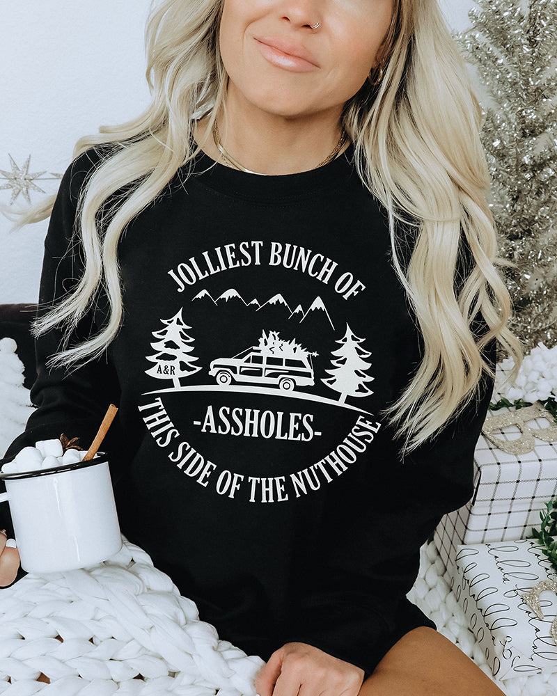 Woman wearing black Jolliest Bunch of Assholes Christmas Vacation sweatshirt