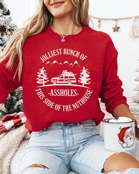 Woman wearing red Jolliest Bunch of Assholes Christmas crewneck sweatshirt