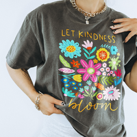 Model wearing Let Kindness Bloom graphic tee in pepper — relaxed unisex floral tee for spring
