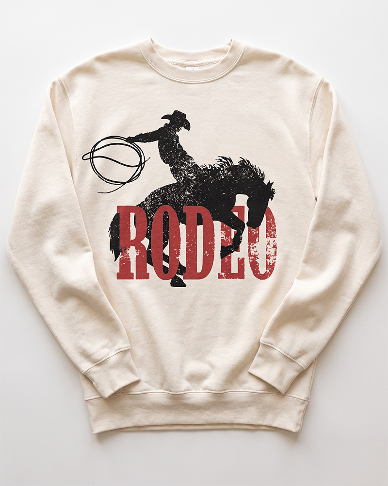 Bone Rodeo Western heavyweight crewneck sweatshirt with distressed black cowboy and bucking horse graphic over red lettering.