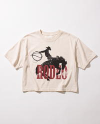 Ivory Rodeo Western boxy crop top with distressed black cowboy and bucking horse graphic over red lettering.
