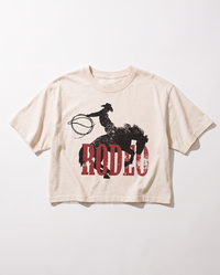 Ivory Rodeo Western boxy crop top with distressed black cowboy and bucking horse graphic over red lettering.