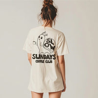 Model wearing ivory Slow Sundays Coffee Club tee — back print with snail and coffee club design