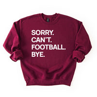 Maroon “Sorry. Can’t. Football. Bye.” sweatshirt — unisex fleece football crewneck in rich team color.