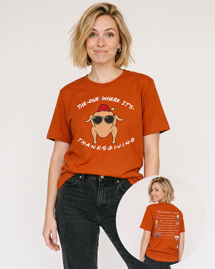 Blonde woman wearing an autumn orange Friends Thanksgiving graphic tee with vintage black jeans, featuring the turkey design and illustrated back print.