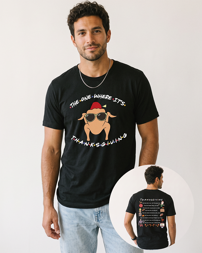 Male model wearing a black Friends-inspired Thanksgiving T-shirt with blue jeans, featuring a turkey in sunglasses on the front and Thanksgiving episode artwork on the back.