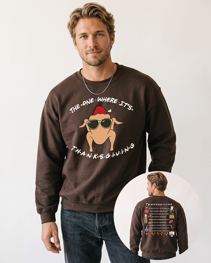 Blond male model wearing a dark chocolate Friends-inspired Thanksgiving crewneck sweatshirt with black denim jeans, showing the turkey front print and Thanksgiving episode back artwork.