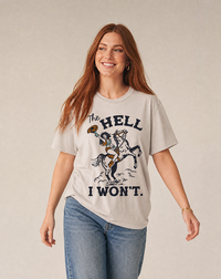 Woman wearing a lightweight Western graphic tee with The Hell I Won't cowgirl and horse artwork.