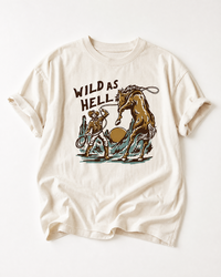 Ivory Wild As Hell Western horse heavyweight tee featuring a cowboy, rearing horse and vintage desert graphic.