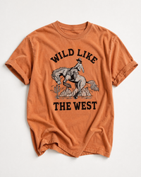 Yam Wild Like The West heavyweight cowboy tee with black bucking horse and vintage desert Western graphic.