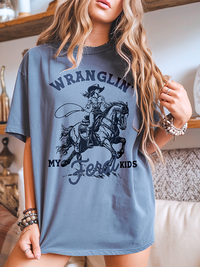 Model wearing blue jean retro western mom graphic shirt