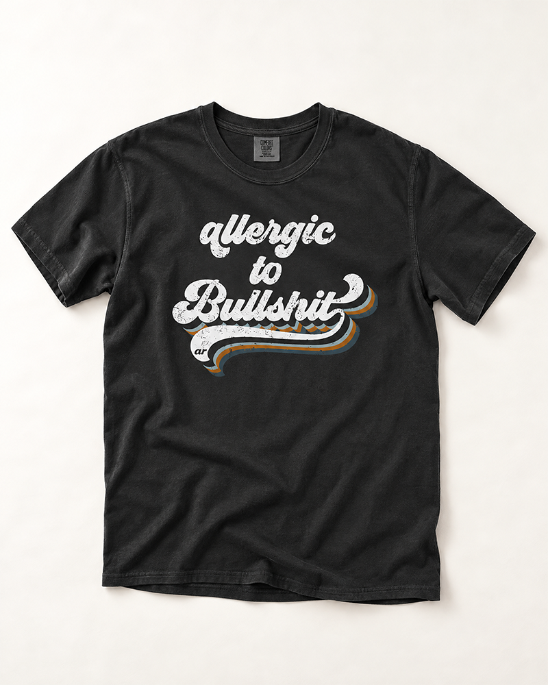 Washed black Allergic to Bullshit heavyweight tee with distressed white blue and rust retro graphic