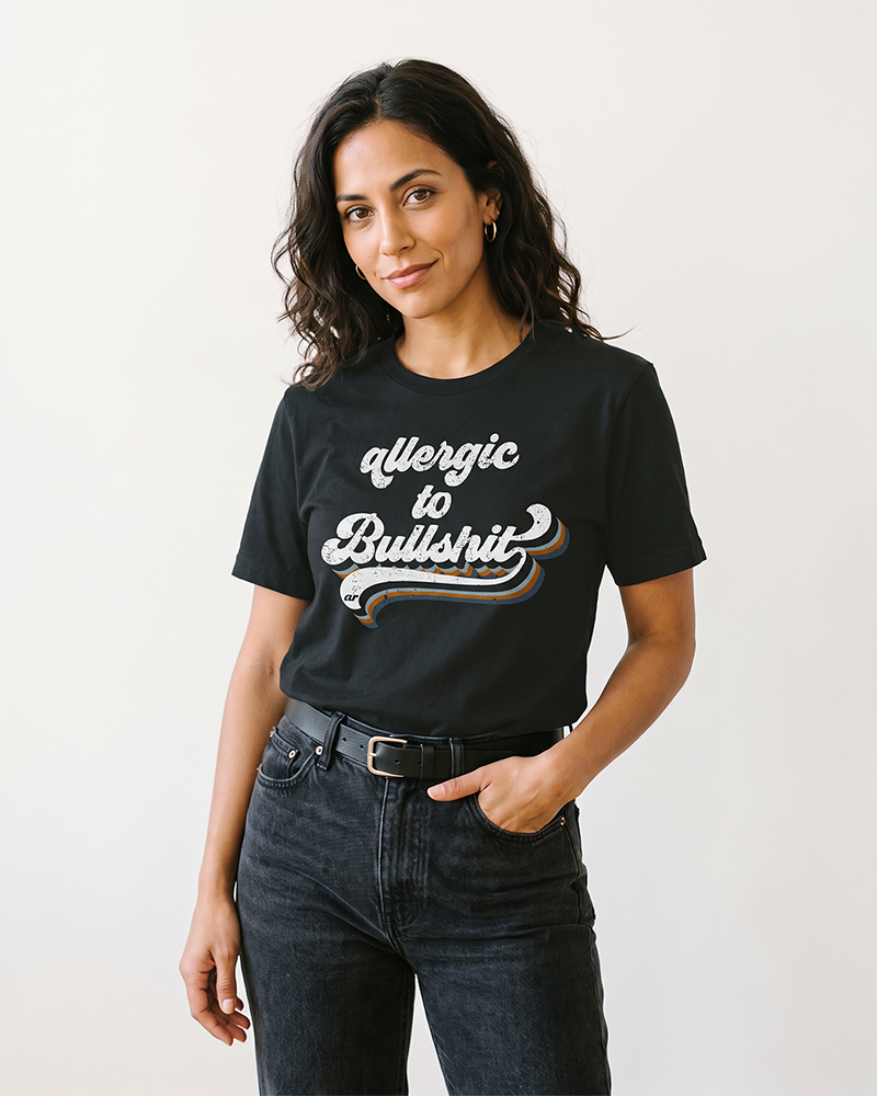 Woman wearing black Allergic to Bullshit retro graphic t-shirt with black jeans