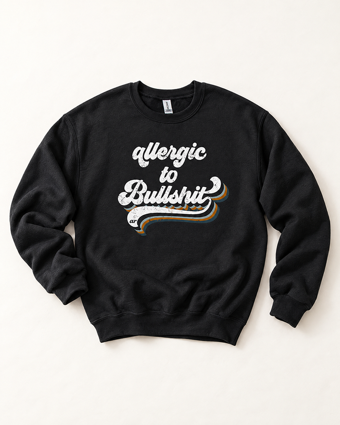 Black Allergic to Bullshit crewneck sweatshirt with distressed white blue and rust retro graphic