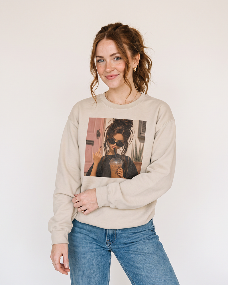 Woman wearing sand iced coffee and attitude graphic crewneck sweatshirt