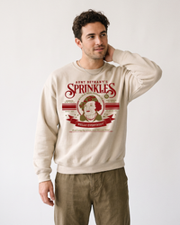 Man wearing sand Aunt Bethany Sprinkles Christmas Vacation crewneck sweatshirt