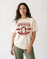 Woman modeling ivory Aunt Bethany Sprinkles heavyweight Christmas graphic tee