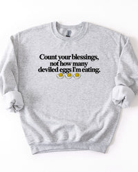 Ash gray Count Your Blessings Not How Many Deviled Eggs I'm Eating Thanksgiving crewneck sweatshirt.