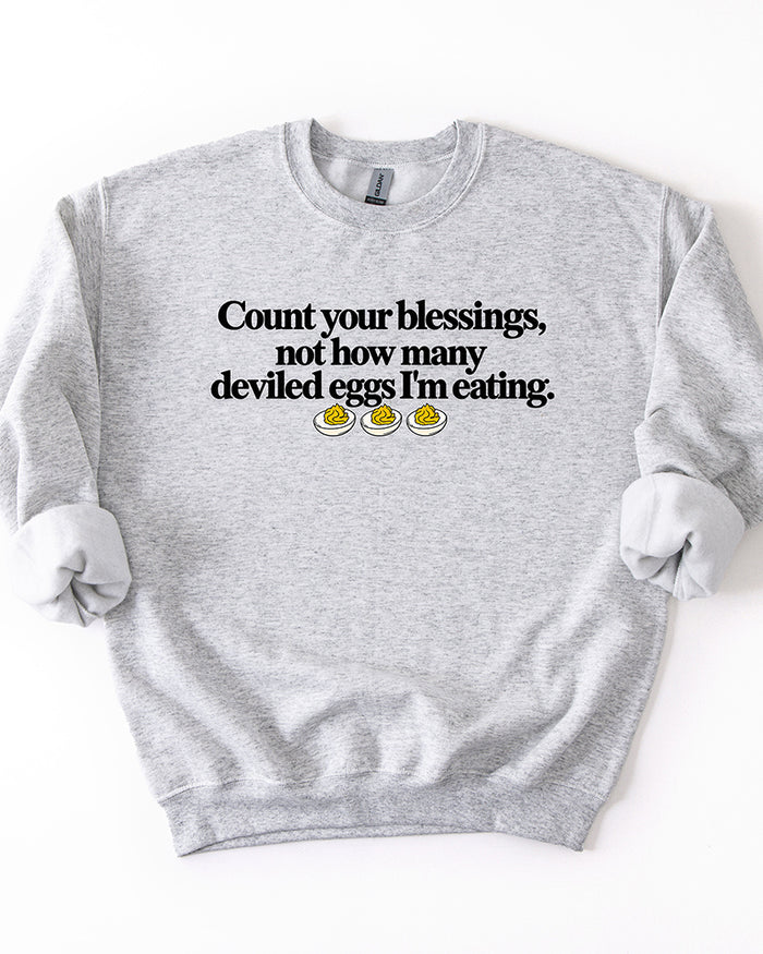 Ash gray Count Your Blessings Not How Many Deviled Eggs I'm Eating Thanksgiving crewneck sweatshirt.