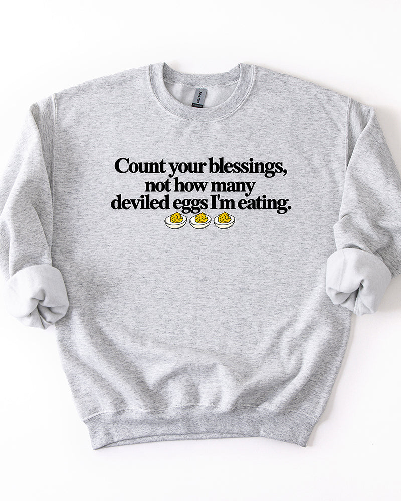 Ash gray Count Your Blessings Not How Many Deviled Eggs I'm Eating Thanksgiving crewneck sweatshirt.