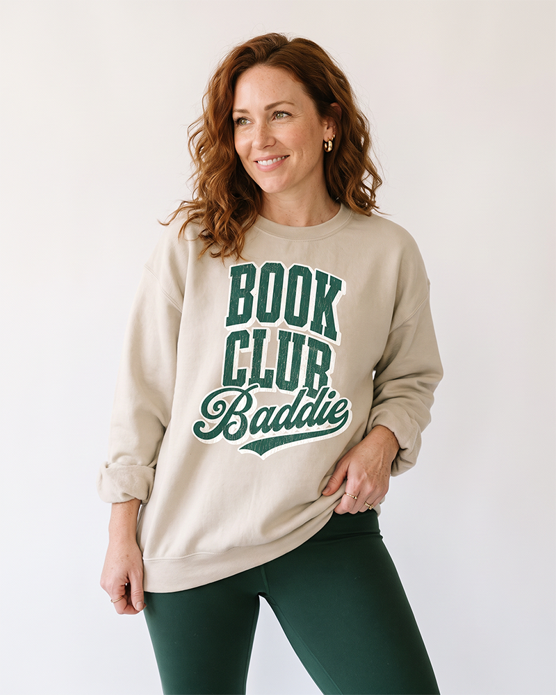 Woman wearing sand Book Club Baddie bookish crewneck sweatshirt