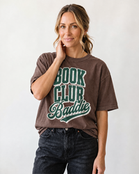 Woman wearing espresso Book Club Baddie heavyweight graphic tee