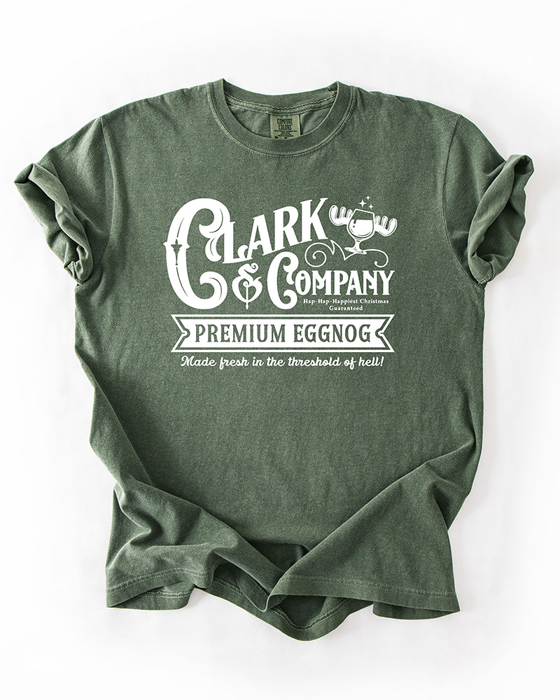 Hemp green Comfort Colors heavyweight tee with white vintage-style Clark & Company Premium Eggnog Christmas Vacation graphic.