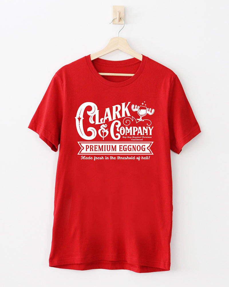 Red Clark & Company Premium Eggnog Christmas Vacation inspired tee featuring a white retro holiday graphic.