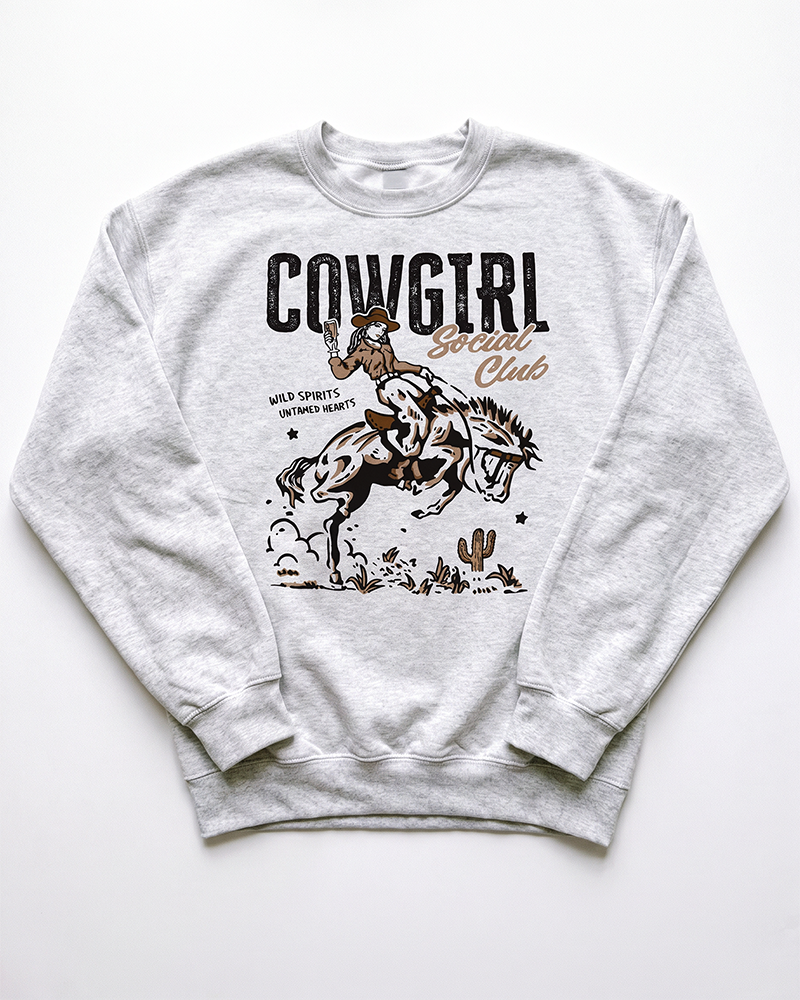 Ash Cowgirl Social Club western sweatshirt with retro bronc riding cowgirl graphic