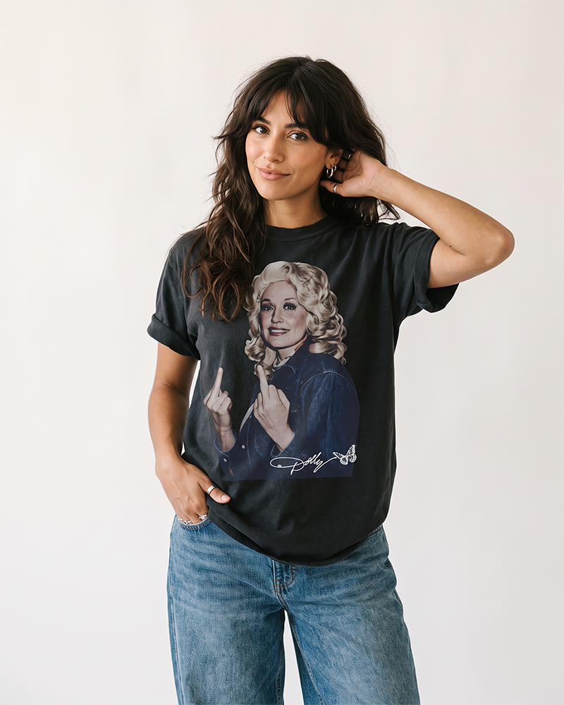 Woman wearing black Dolly Parton flipping the bird graphic tee