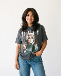 Woman wearing Dolly Parton vintage portrait graphic tee in washed charcoal