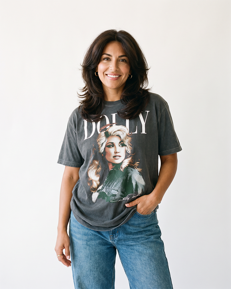 Woman wearing Dolly Parton vintage portrait graphic tee in washed charcoal