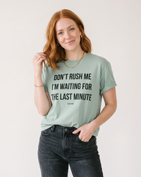 Woman wearing Bay green Don't Rush Me funny procrastination graphic tee