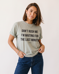 Woman wearing Don't Rush Me I'm Waiting For The Last Minute funny procrastination tee in Sandstone