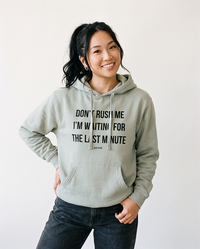Woman wearing Dusty Sage Don't Rush Me I'm Waiting For The Last Minute hoodie